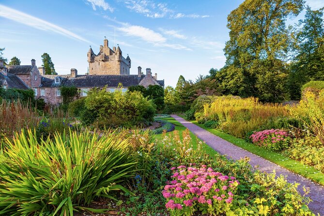 From Inverness: Cawdor Castle, Cairngorms and Highland Coos - Loch Morlich and Glenmore Visitor Centre: calm water, mountain views, easy walking