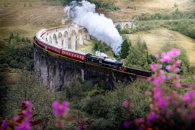 Loch Ness , Heilan Coos ,Great Glen , Fort William and Glencoe - Glenfinnan: Bonnie Prince Charlie’s Standard and the Viaduct at Train Time